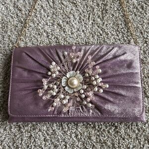 Elegant Purple Clutch with Floral Embellishment